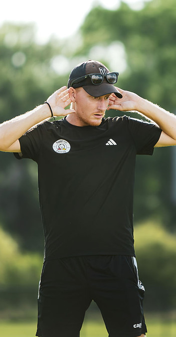 A HappyFeet coach leading a preschool class