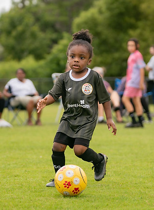A young HappyFeet player on the field