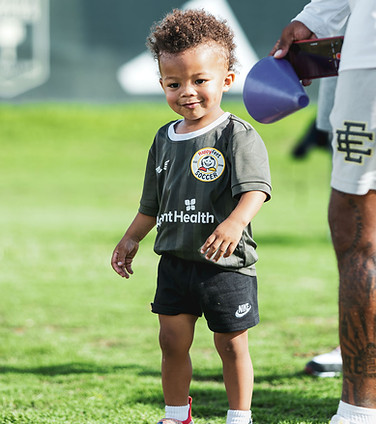A two-year-old HappyFeet player