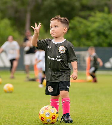 A four-year-old HappyFeet player in action